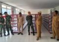 Dandim 0801/Pacitan Letkol Arh. Rudi Ariyanto bersama Tim Verifikasi dan Validasi (Verval) Dinas Koperasi Kabupaten Pacitan saat meninjau kesiapan gedung dan sarana prasarana KDKMP di Kecamatan Arjosari, Pacitan, Senin (28/9/2026). (Foto: Dok. Kodim 0801/Pacitan)